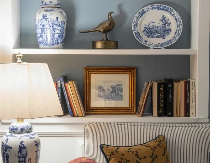Farmhouse Living Room Bookshelf Styling with Vintage Books and Blue China
